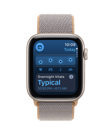Apple Watch SE 3, screen shows overnight vitals, aluminum case, starlight color, right side exterior, Digital Crown dial, connected to Sport Loop band, chambray blue color (light blue-gray)