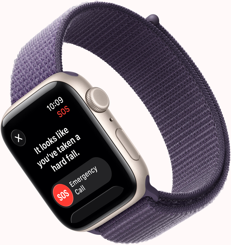 „Apple Watch SE 3“, aliuminio korpusas, žvaigždžių šviesos spalva, SOS nukritimo aptikimo pranešimas, skambučio pagalbos tarnyboms ir „Man viskas gerai“ mygtukai, dešinės pusės išorinė dalis, „Digital Crown“, mikrofonas, šoninis mygtukas, sportinis dirželis, violetinės miglos spalva