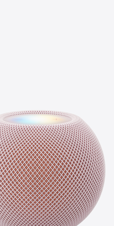 Un HomePod mini 2 rosa mostrato da vicino con il display sulla parte superiore illuminato