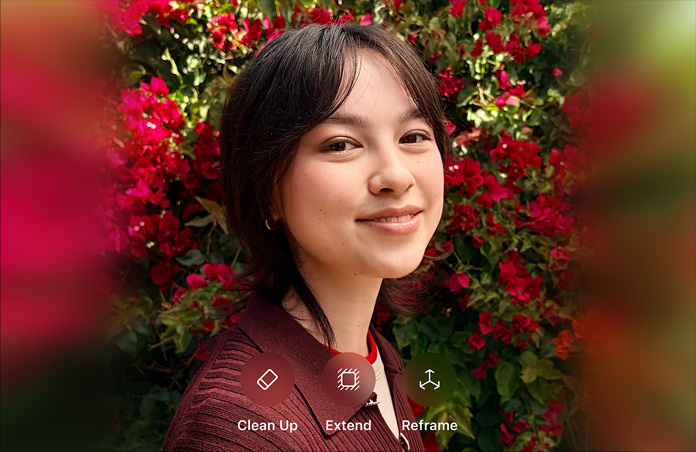 Photo d’une personne souriante aux cheveux bruns, portant un pull marron, entourée de fleurs rouges, démonstration de retouche photo par IA avec les options Correction, Étendre et Recadrer affichées sur la photo